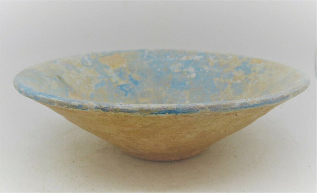 Earthenware bowls covered with a bright blue slip